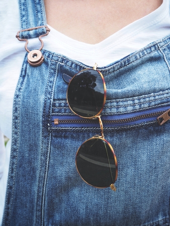 Woman and sun glasses with jeansの写真素材