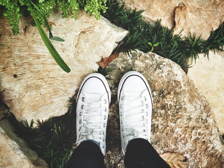 Selfie of sneakers on stoneの写真素材