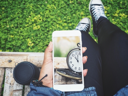 Taking a photo of watch pocket with smart phone and bluetooth speakeの写真素材