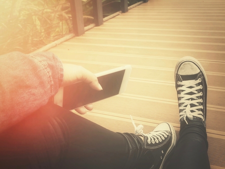 Selfie of smart phone with shoesの写真素材