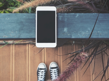 Selfie of smart phone with shoesの写真素材