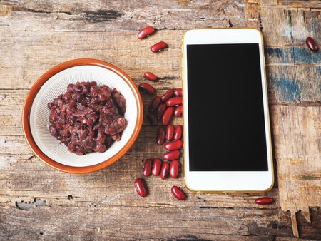 Smart phone with azuki red beans pasteの写真素材
