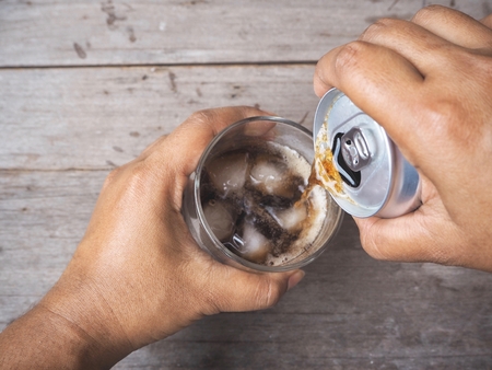 Pouring cola drinkの写真素材