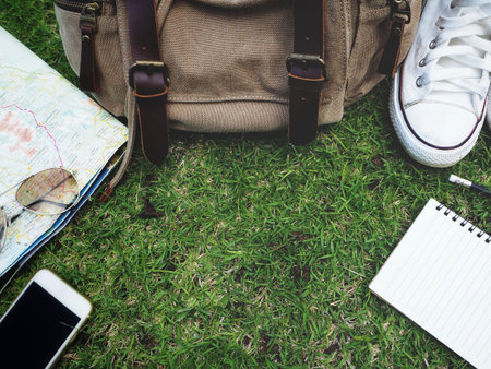 Travel accessories of bag with shoes and smart phone with sunglasses