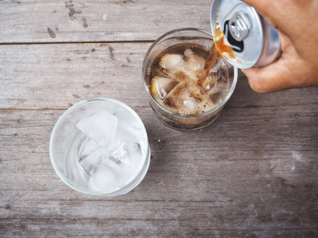 Pouring cola drinkの写真素材