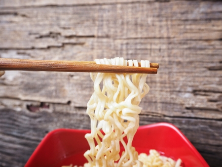 Instant noodles with chopsticksの写真素材