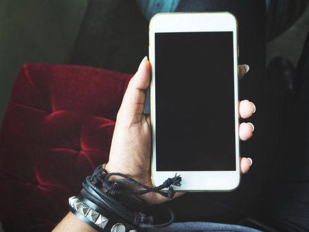 Woman using smart phone with hand