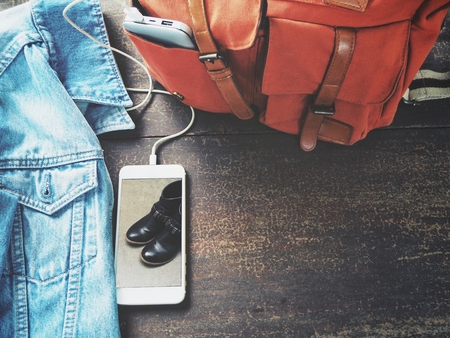 Power bank with smart phone on office tableの写真素材