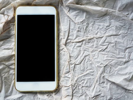 Smart phone on paperの写真素材