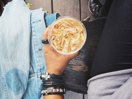 Woman drinking iced coffee