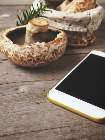 Smart phone with portobello mushroomsの写真素材