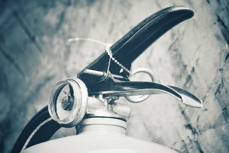 Black with white fire extinguisherの写真素材