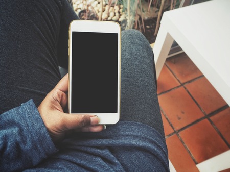 Woman using smart phone on handの写真素材