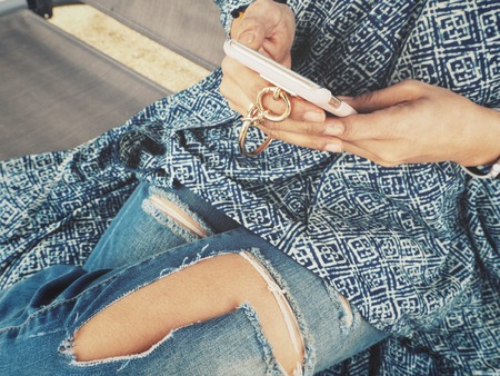 Woman using smart phone on handの写真素材