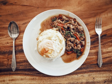 Pork basil with rice and egg Thai foodの写真素材