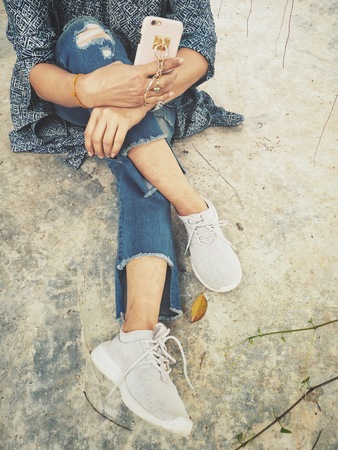 Woman using smart phone on handの写真素材