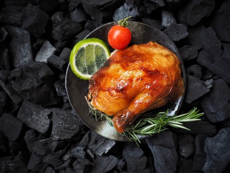 Roasted chicken leg on charcoaの写真素材