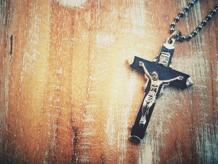 Cross on wood backgroundの写真素材