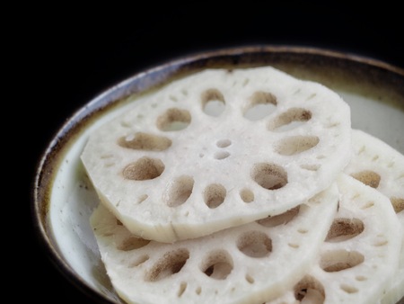 Lotus root on black backgroundの写真素材