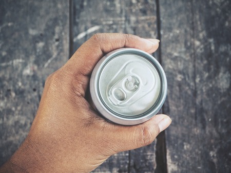 Cola can on handの写真素材