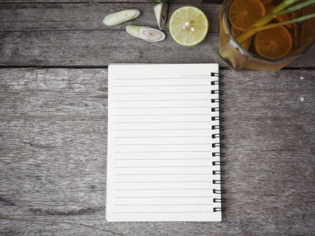 Lemon grass tea and blank notepadの写真素材