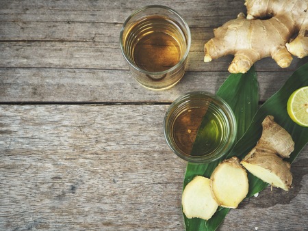 Ginger drink on wood backgroundの写真素材