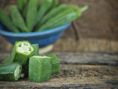 Green okra on wood backgroundの写真素材