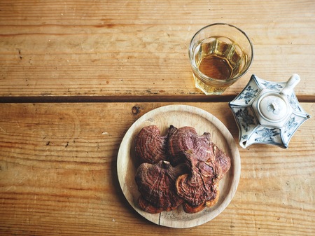 Ganoderma Lucidum - Ling Zhi Mushroom and tea potの写真素材