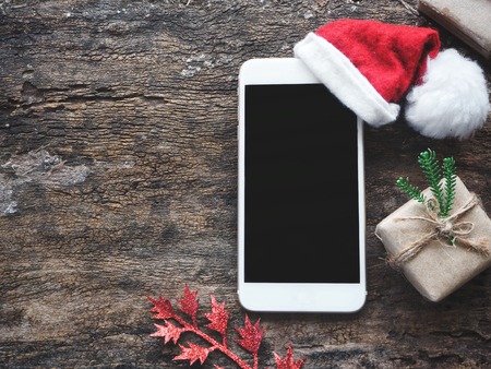 Smart phone with christmas hatの写真素材