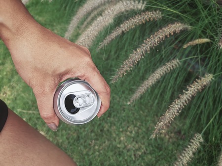 Cola can on handの写真素材