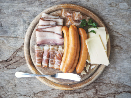 Sausage ham and bacon on wood background