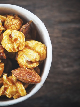 Popcorn caramel on wood backgroundの写真素材