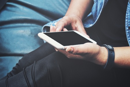 Woman using smart phone on handの写真素材