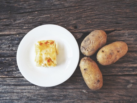 Baked potato on wood backgroundの写真素材
