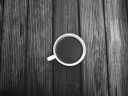 Black coffee cup on wood backgroundの写真素材