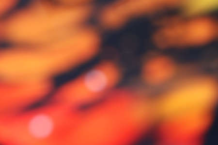 Blurred of orange and black background or textureの写真素材