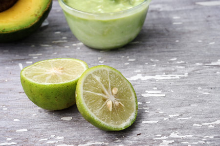Green lime on wood background
