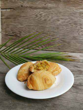 Curry puff on wood backgroundの写真素材