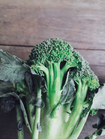 Green broccoli healthy food on table wood background