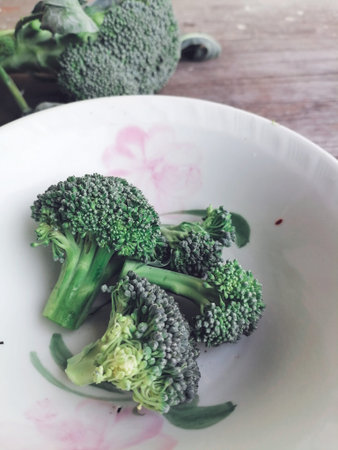 Green broccoli healthy food on table wood background