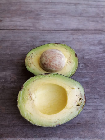 Fresh avocado fruit on table wood background