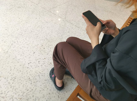 Woman using smart phone on handの写真素材