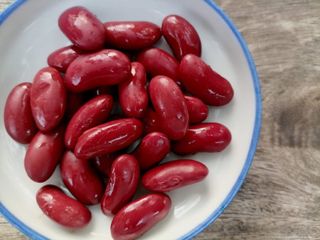 Red beans on brown wood background