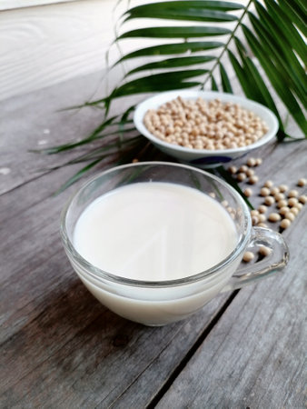 Soy milk with soybean on wood backgroundの写真素材