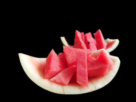 Watermelon summer fruit on black backgroundの写真素材