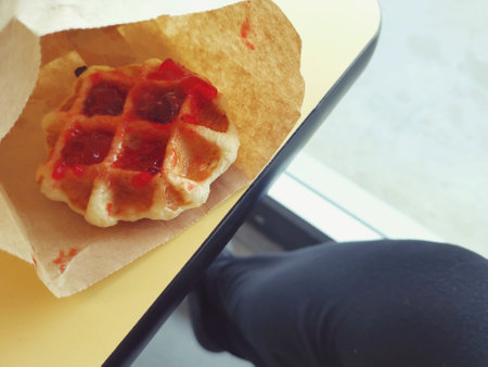 Breakfast of waffle with strawberry jamの写真素材