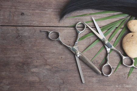 Hair cutting shears on wood backgroundの写真素材
