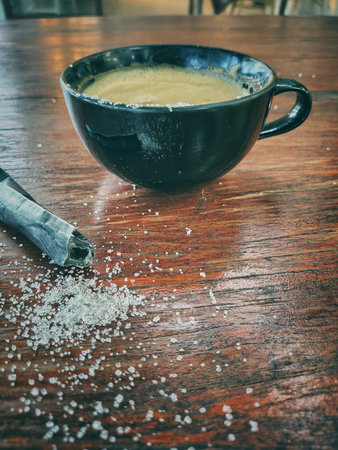 Latte coffee with milk and sugar on wood backgruondの写真素材