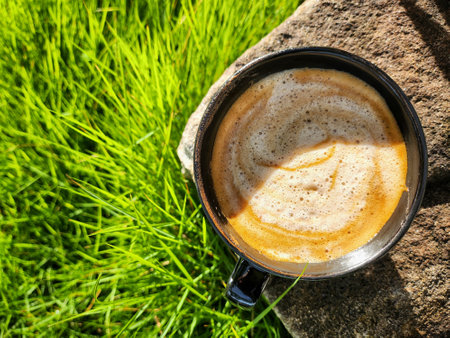 Latte coffee with milk in the gardenの写真素材