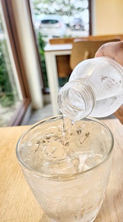 Pouring drinking water in a glass